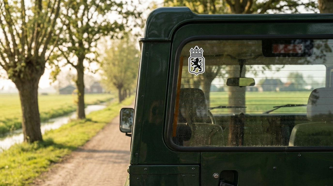 KWPN Dutch Warmblood registry vinyl sticker on a green Land Rover Defender on a Dutch country lane, warmblood breed sticker decal