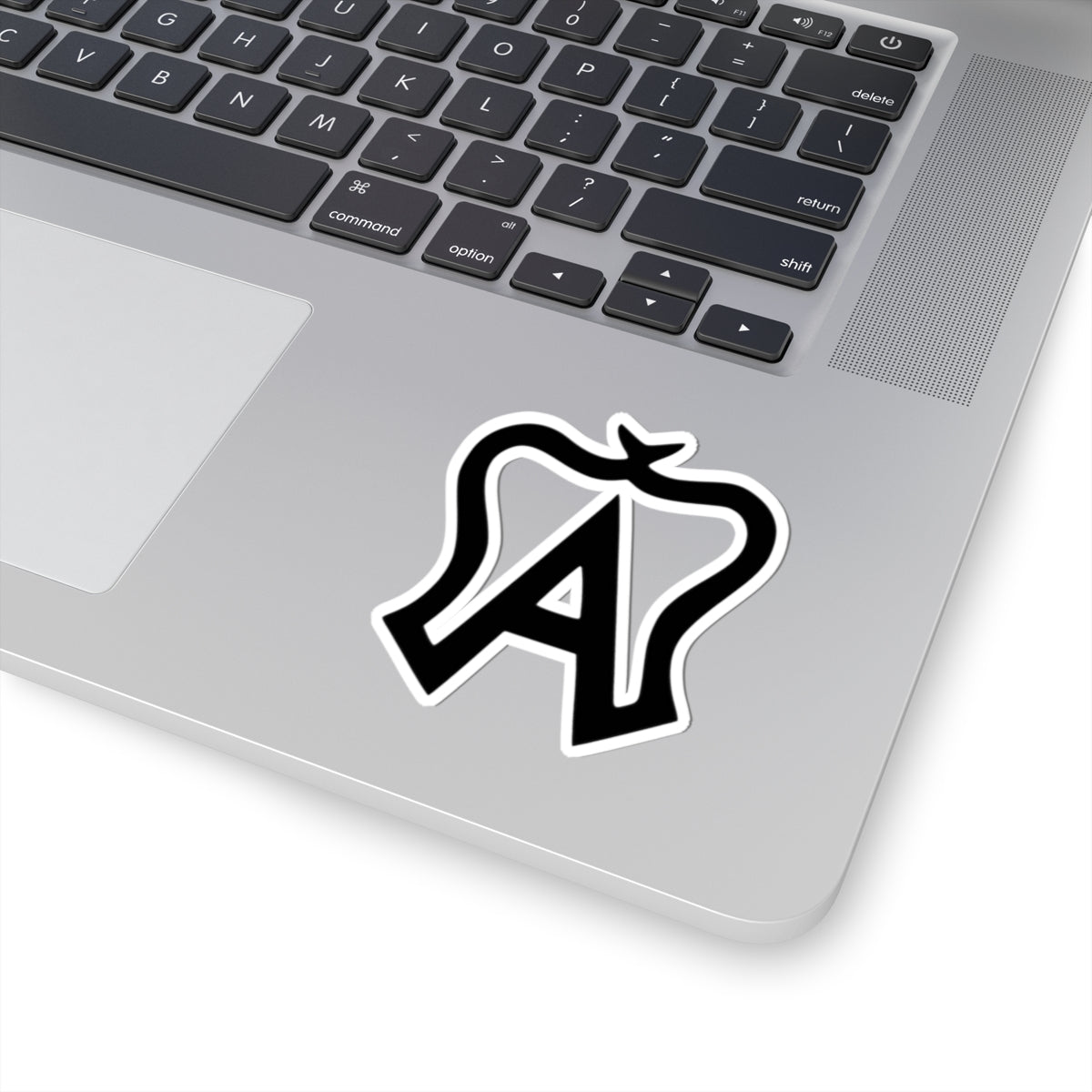 Laptop with a black and white logo sticker on the palm rest area