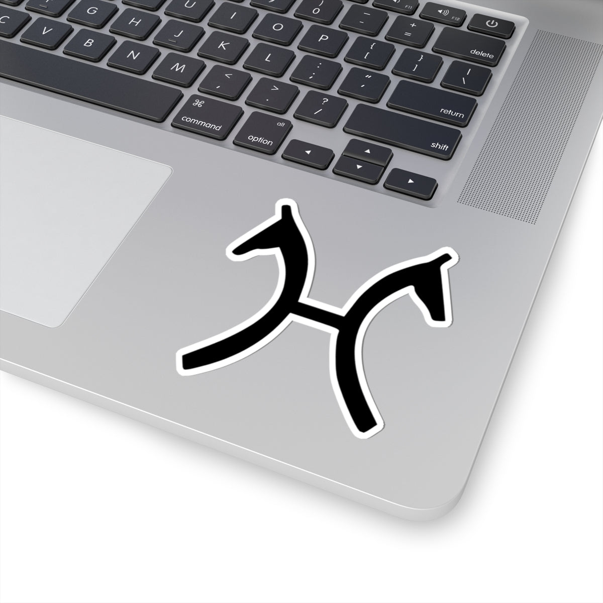 Black horse H logo figure sticker on a laptop
