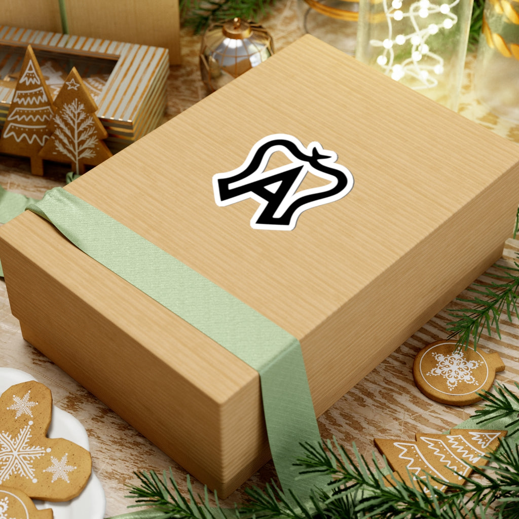 Wooden gift box with a green ribbon and a logo on a festive background with cookies and lights.