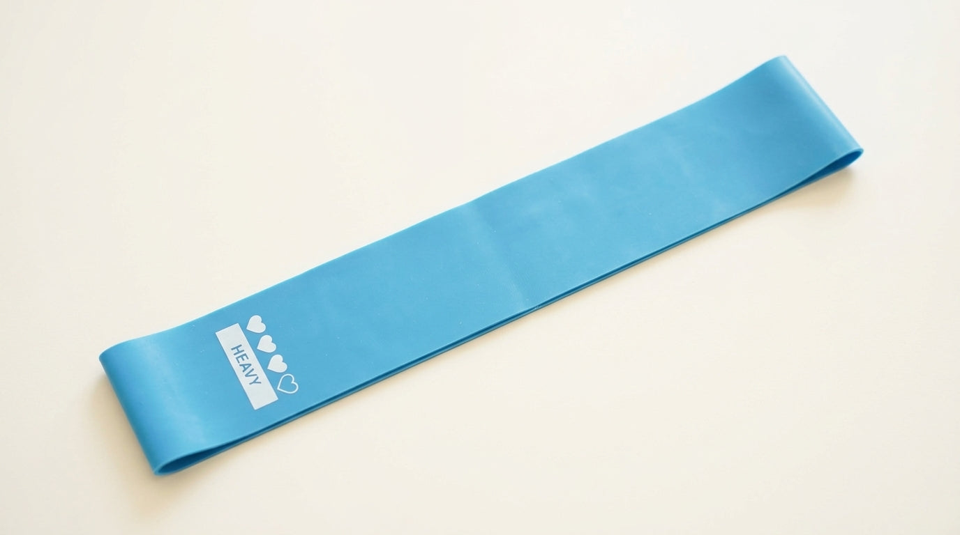 Flat loop resistance band in light blue on a neutral background — Notting Hill Equine Rider Fitness