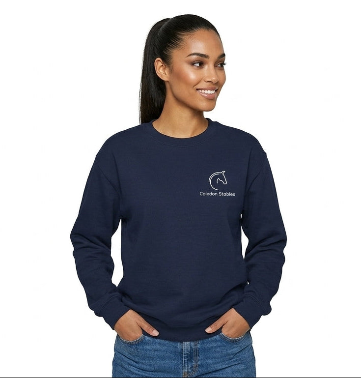 Woman wearing a navy blue sweatshirt with a logo on a white background