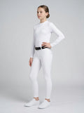 Person wearing a white long-sleeve top and white pants on a gray background