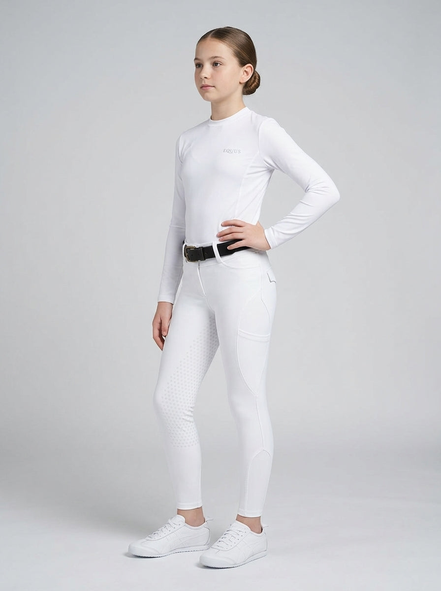 Person wearing a white long-sleeve top and white pants on a gray background