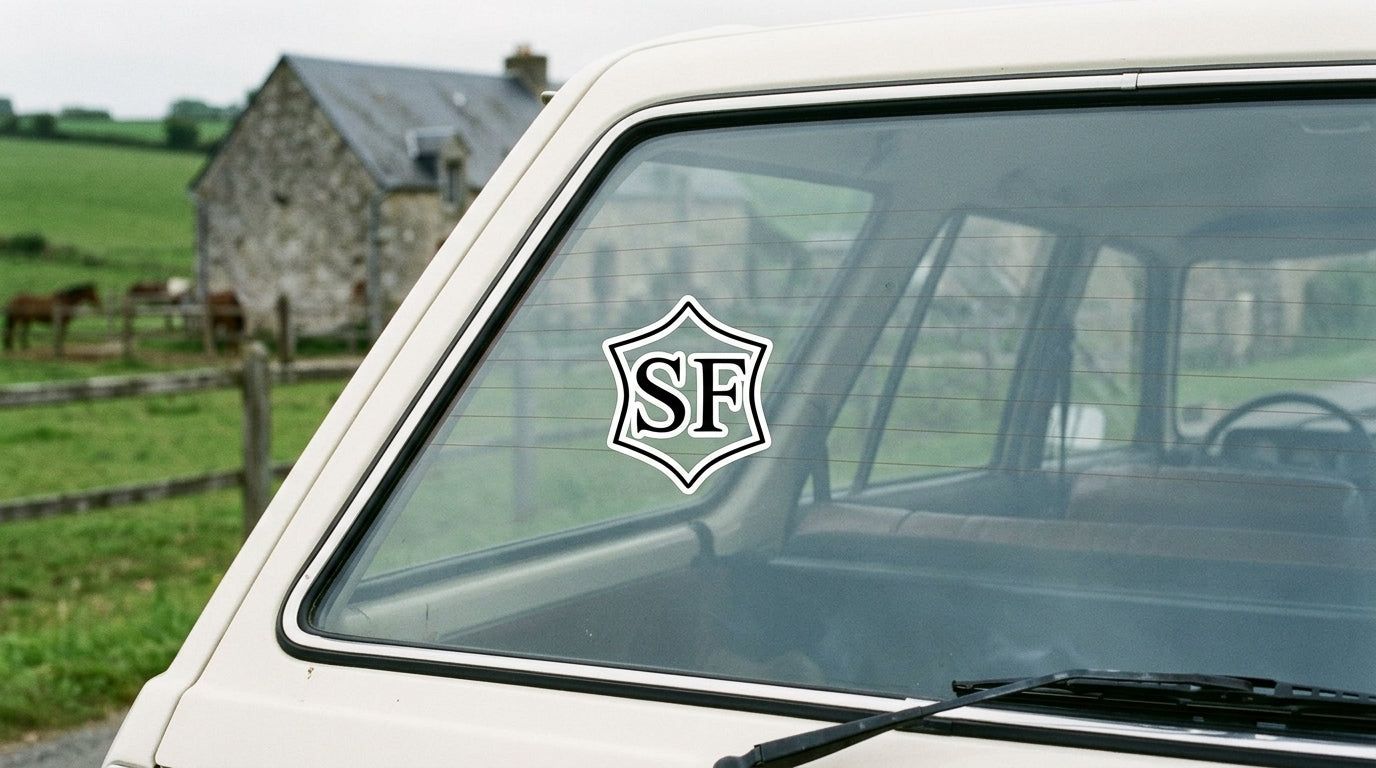 Selle Français registry vinyl sticker on a cream Peugeot on a Normandy country road in France, warmblood breed sticker decal