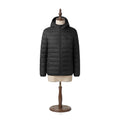 The Barn Heated Jacket in Midnight black, front view on a beige dress form with walnut stand — Notting Hill Equine