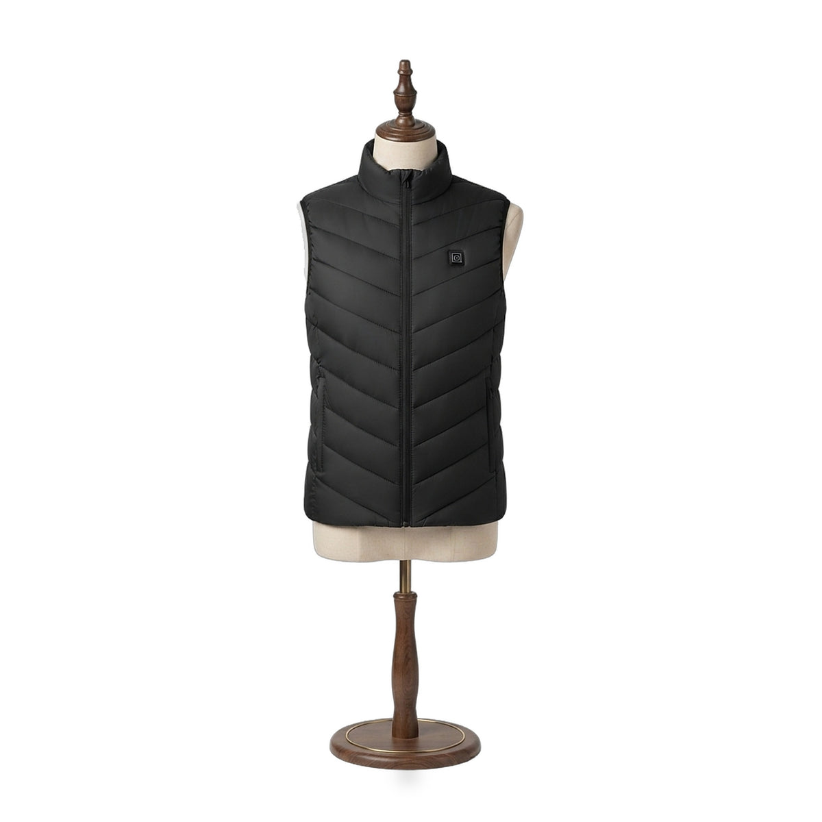 The Warm Up Heated Vest in Midnight black with chevron quilting, front view on a beige dress form — Notting Hill Equine
